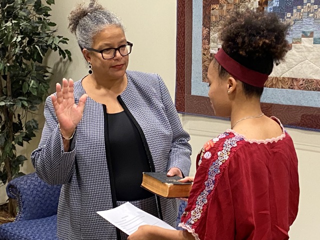 Dr. Somersille taking the oath of office.